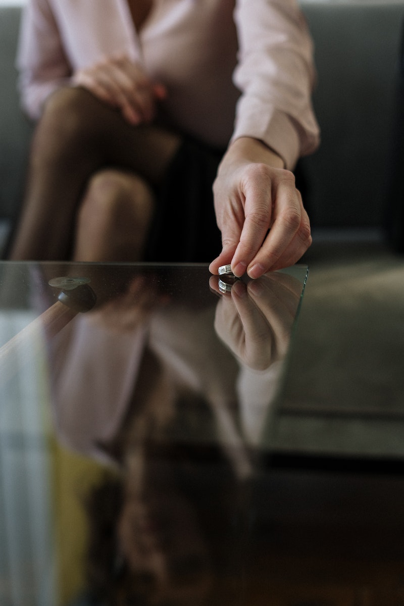 A wedding ring on a table — divorce
